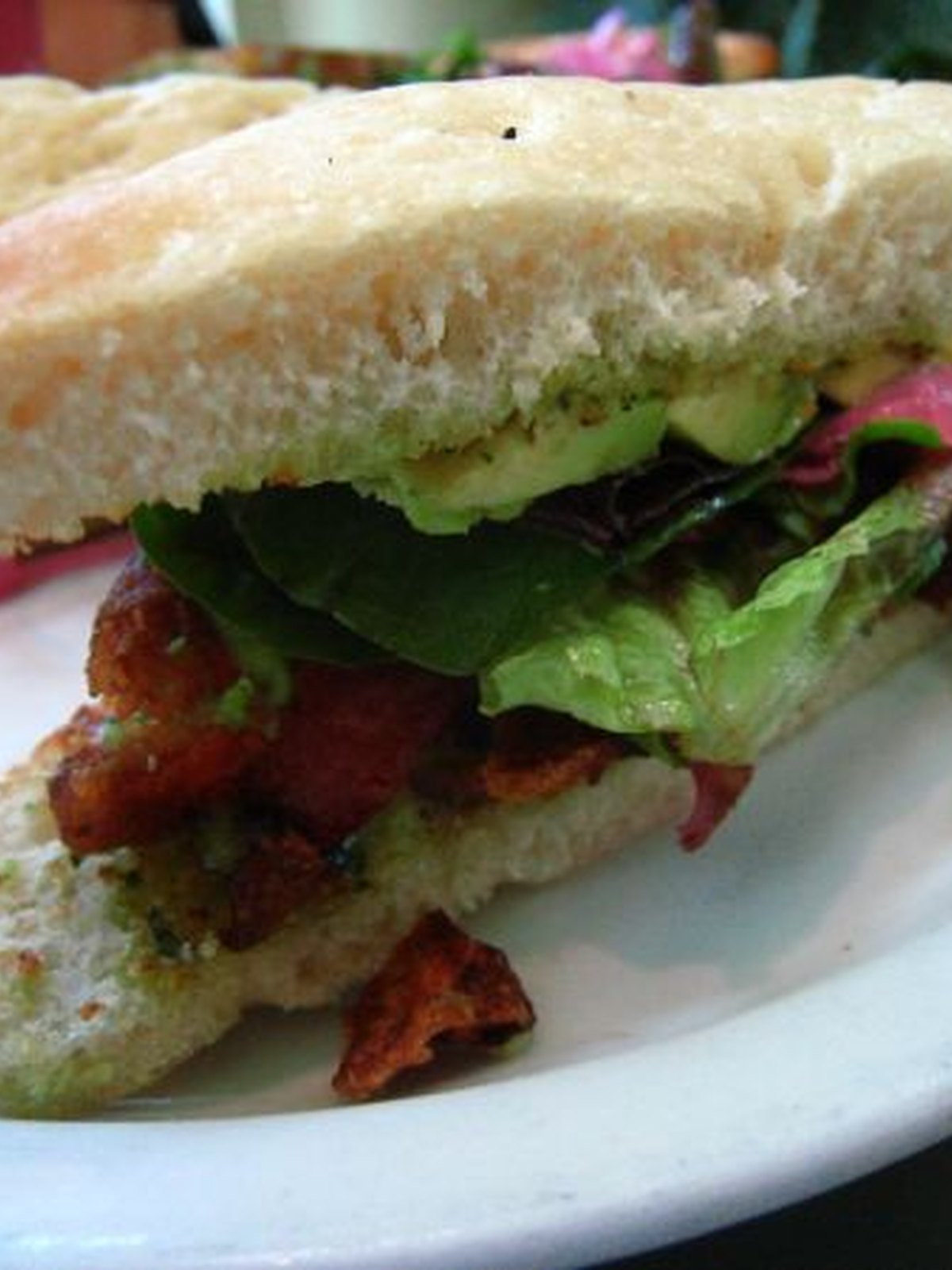 Toasted BLT sandwich with avocado, tomato, and bacon