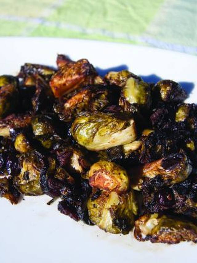 Air-fried Brussels sprouts with crisp bacon bits in a serving bowl