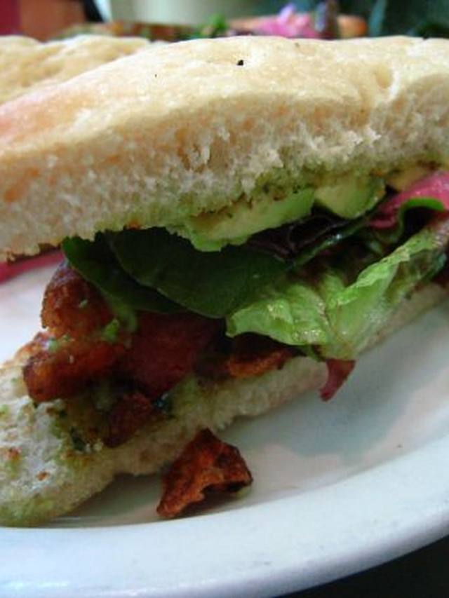 Toasted BLT sandwich with avocado, tomato, and bacon