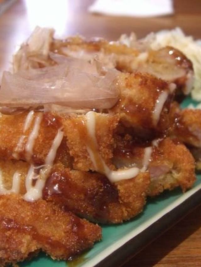 Baked pork chops on a bed of rice with onion and paprika