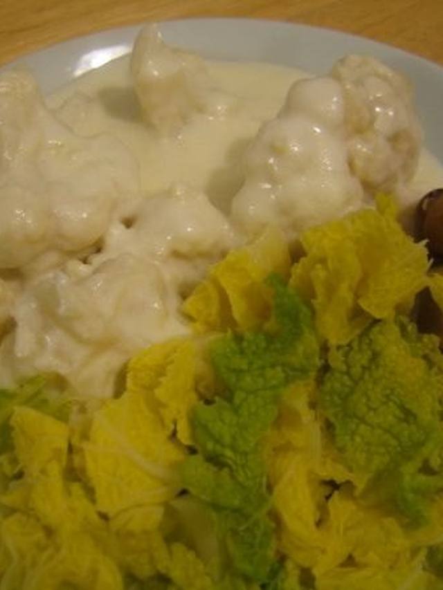 Skillet of fried potatoes and cabbage with a fried egg