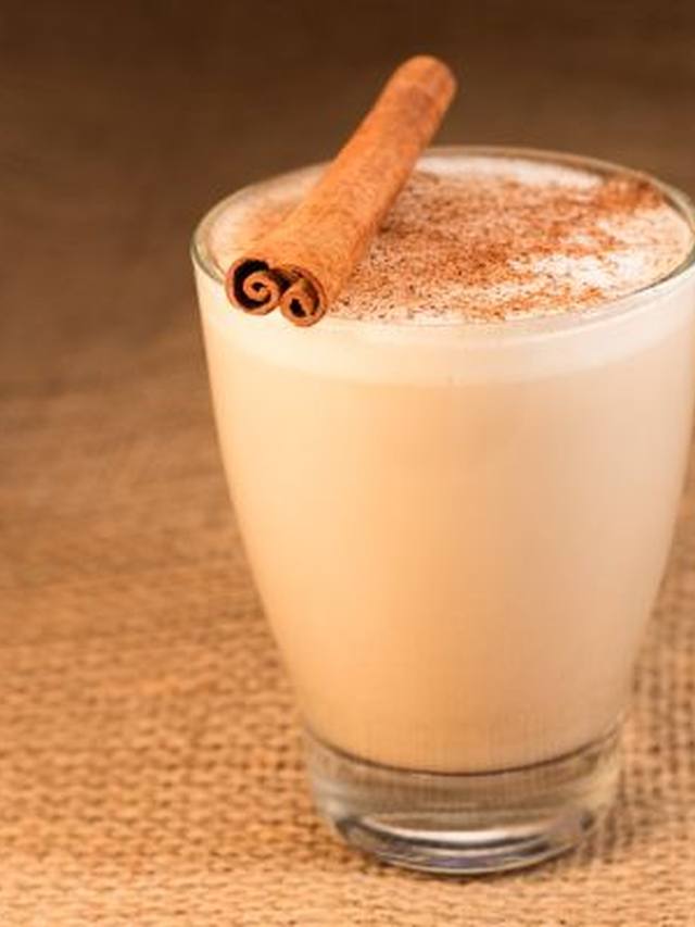 Mug of cinnamon hot chocolate with light foam on top