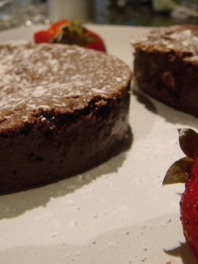 wedge of flourless chocolate espresso cake with glossy top
