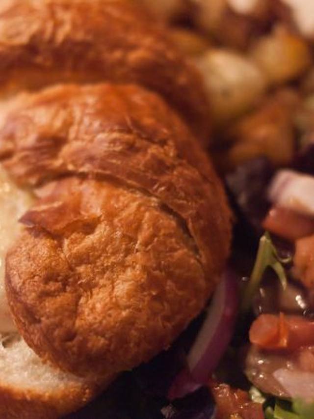 Golden ham and Swiss croissant bake in a casserole dish