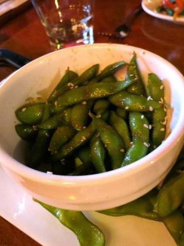 Skillet edamame glazed with honey and sesame seeds
