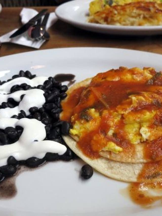 Skillet huevos rancheros with eggs beans and salsa