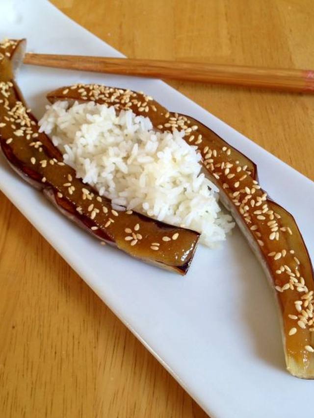 Roasted eggplant halves with a dark miso glaze and sesame