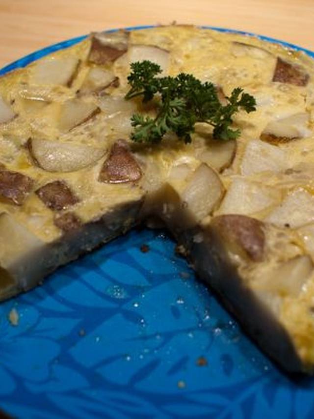 A wedge of potato and onion frittata