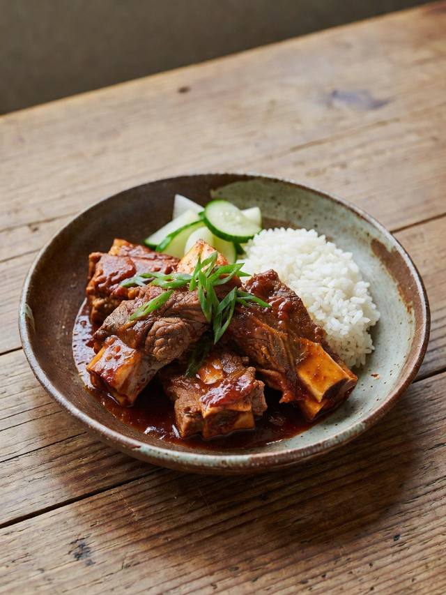 Korean-style short ribs with glossy sauce over rice