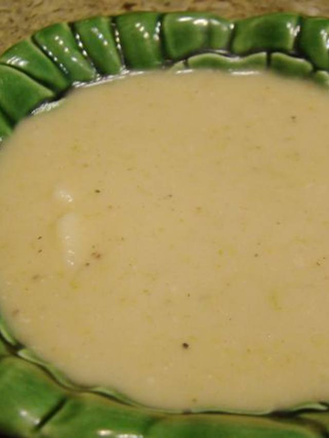 Creamy potato leek soup in a bowl with cracked pepper