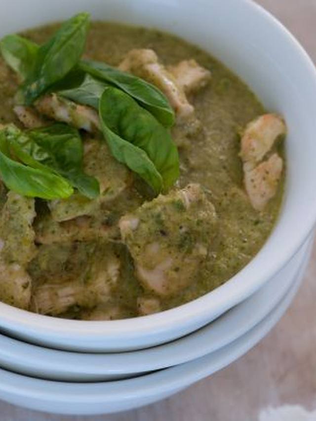 Green curry chicken with zucchini and basil in a bowl