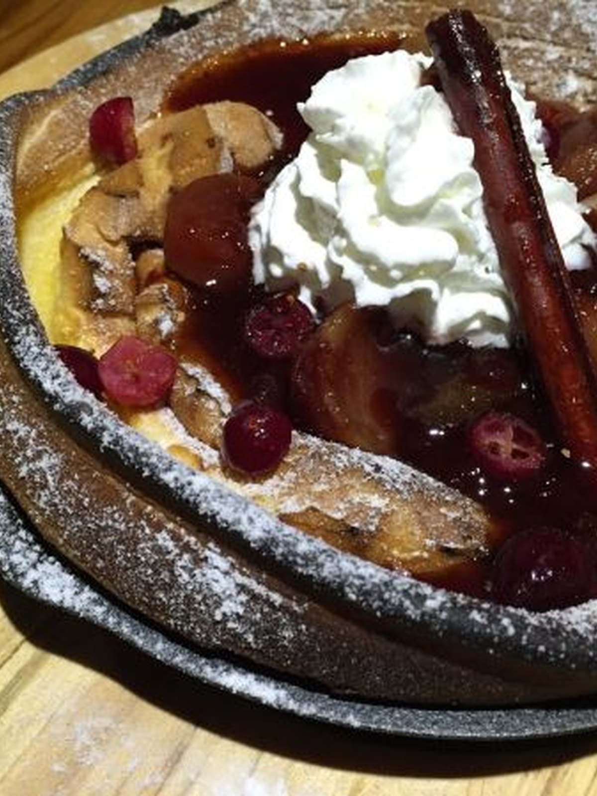 Puffed cinnamon apple dutch baby in a skillet