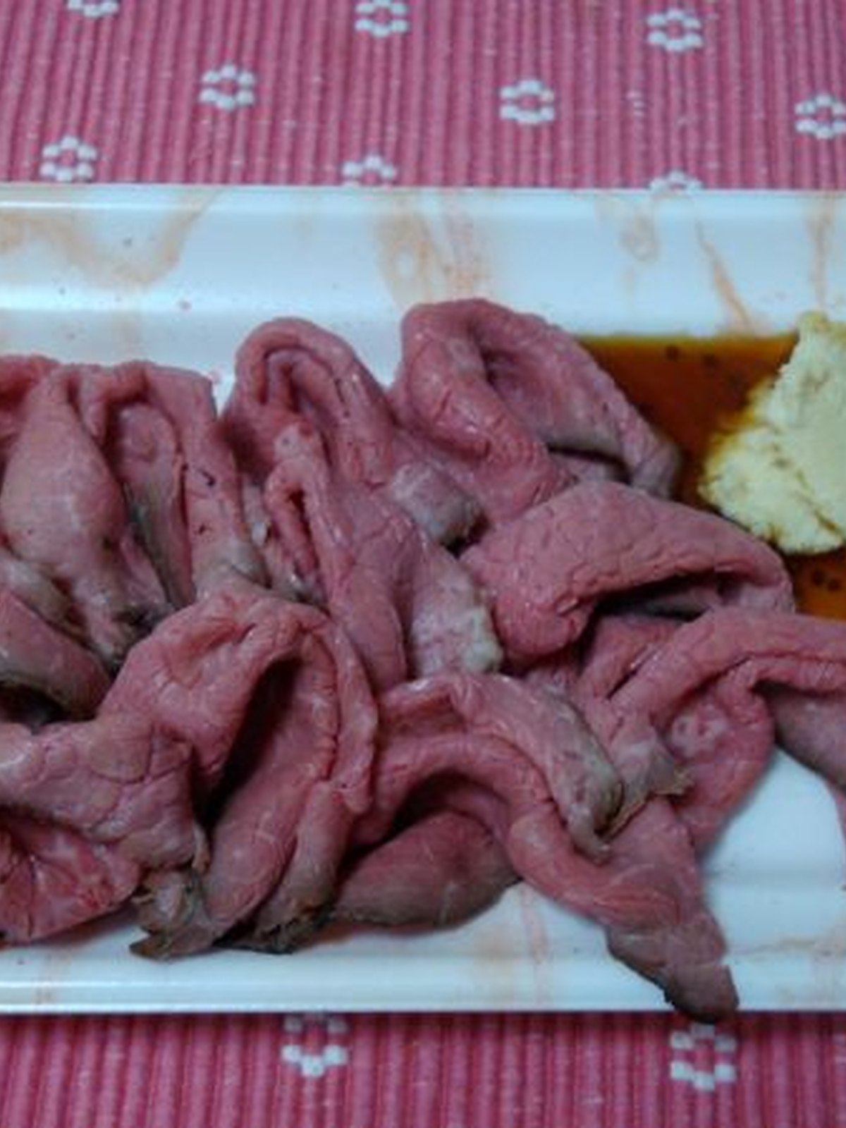Roast beef sandwich with horseradish and lettuce on toasted bread