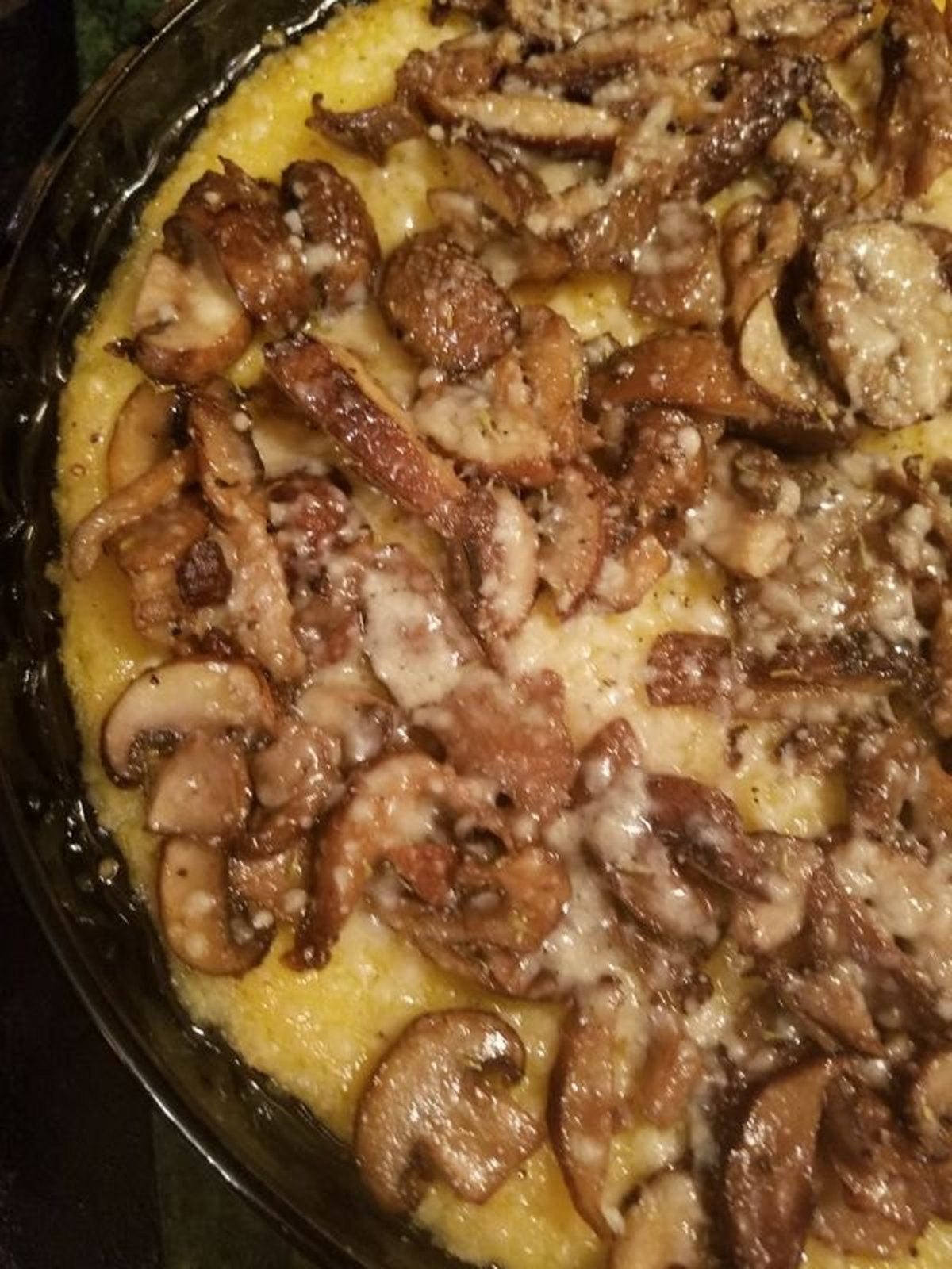 Golden spinach mushroom frittata sliced in a cast-iron skillet