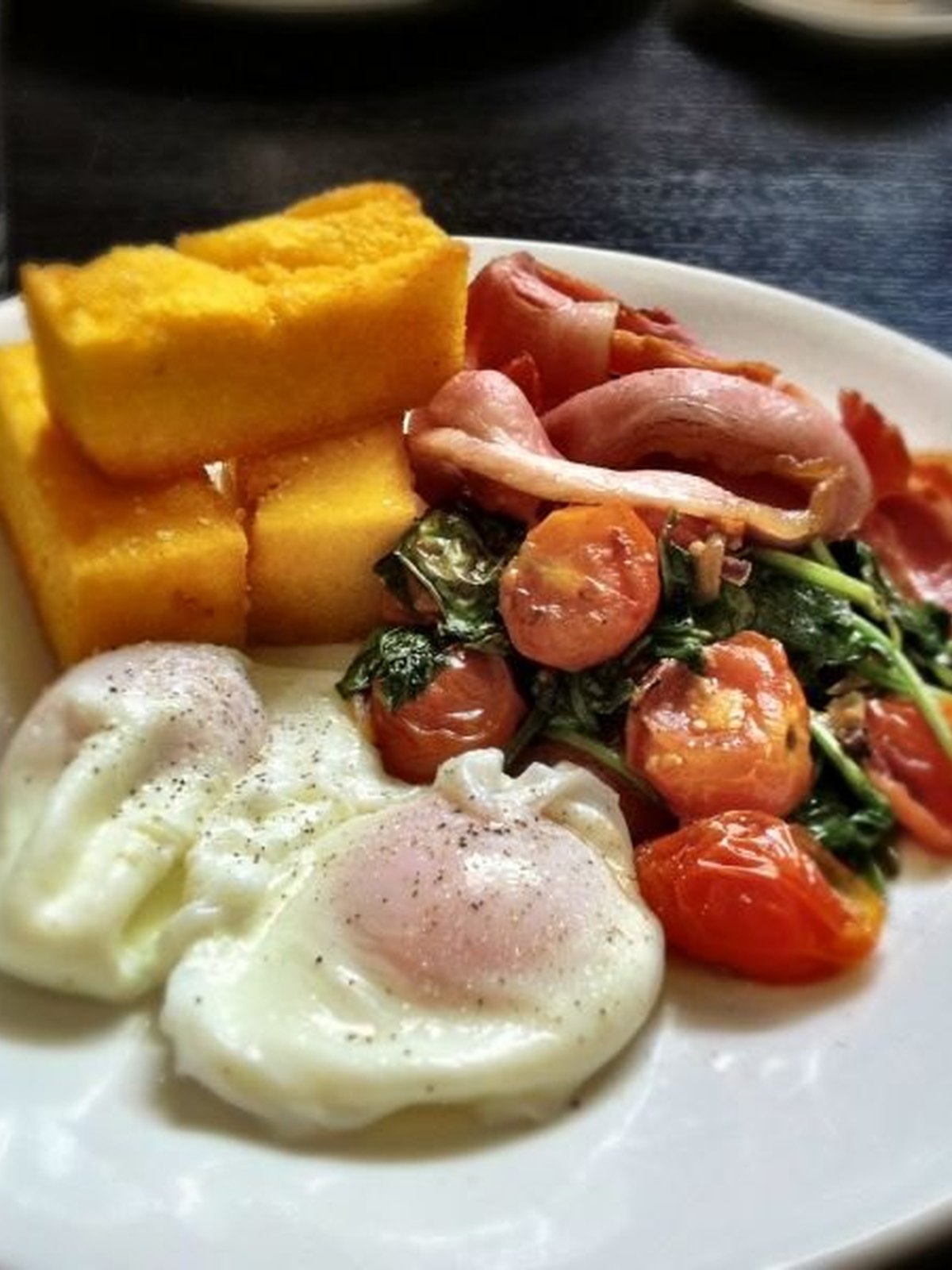 Eggs poached in spiced tomato sauce on toast
